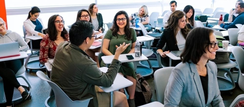 Students engage in conversation in their classroom in Ontario, Canada.