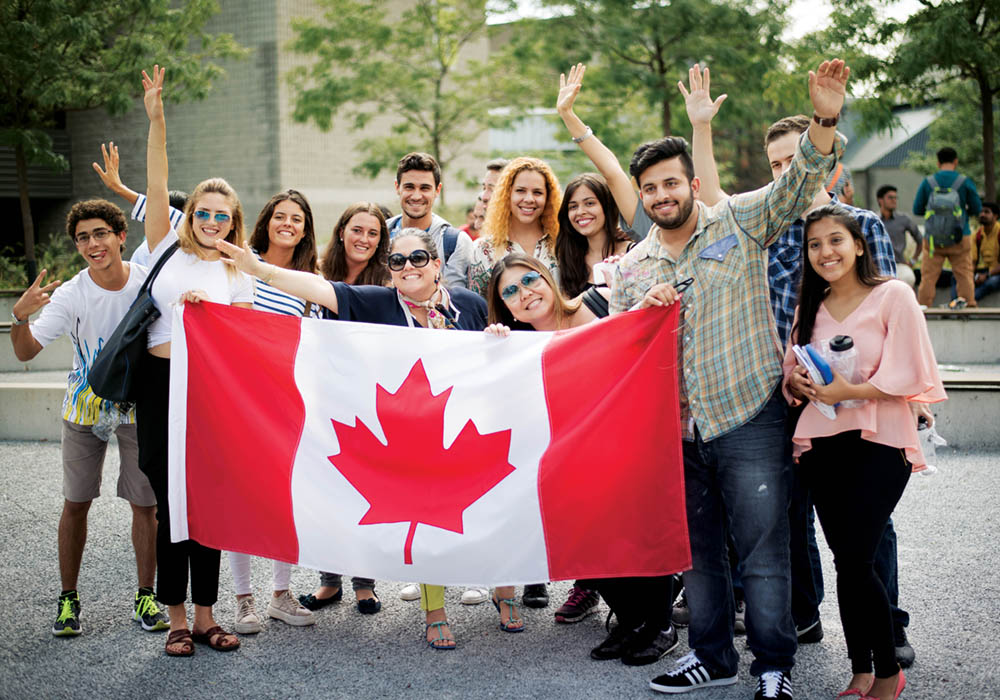 International students display a Canadian flag in the summer time on campus at Centennial College
