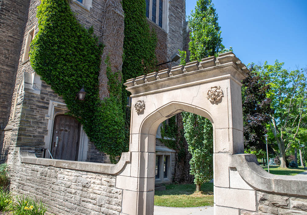 The Edwards Arch at McMaster University in Hamilton, Ontario, Canada on a bright summer day. The Edwards Arch is a popular spot for students and alumni to stop and take photographs.