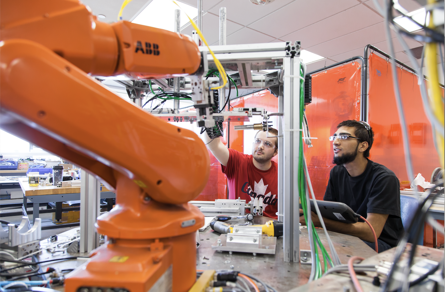 Conestoga College students working on a hands on project in Robotics program