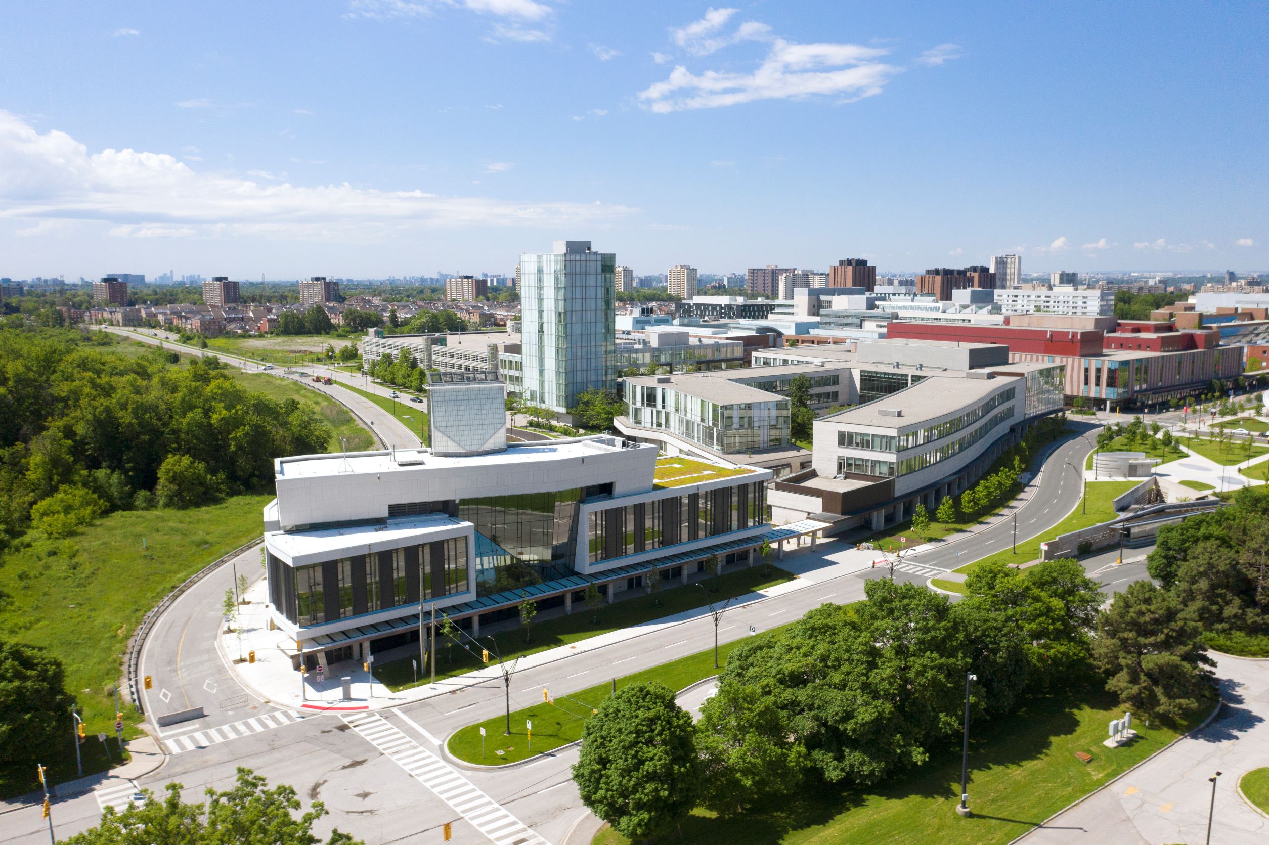 Aerial view of academic buildings and green trees at the southeast corner of York University's Keele Campus
