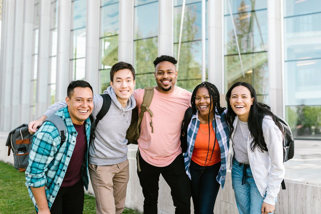 five students smiling for a photo